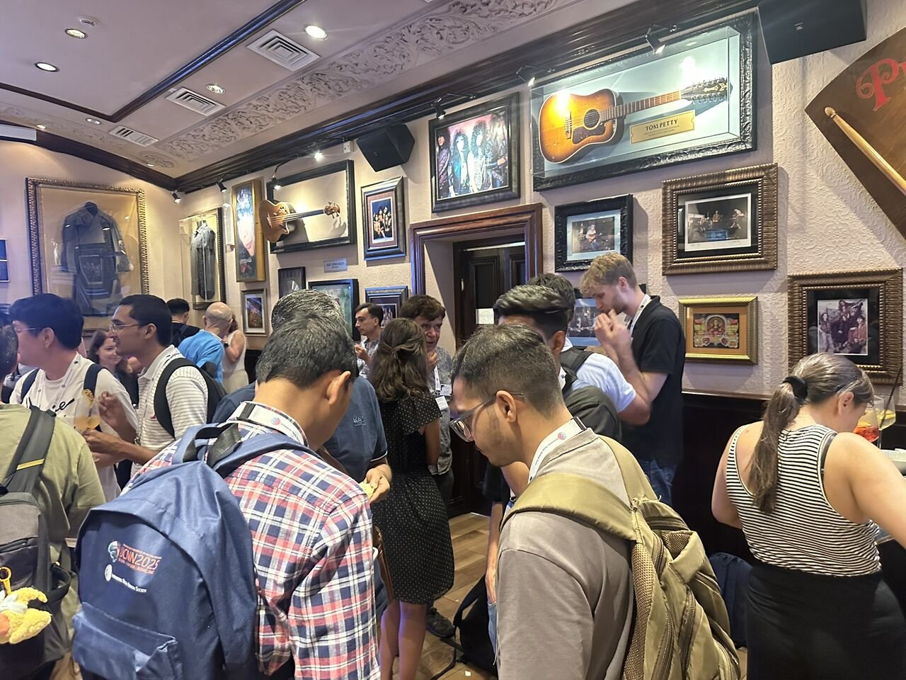 Researchers networking at the IJCNN 2025 mentoring dinner in Rome